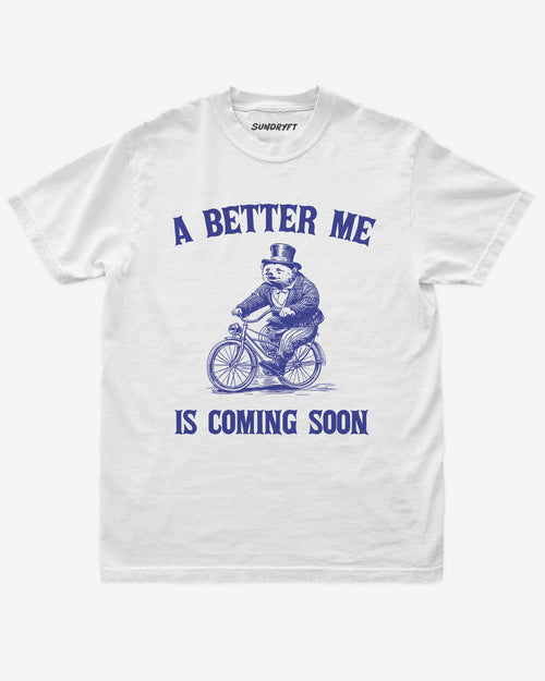 A Better Me Is Coming shirt in white with retro graphic of bear riding bicycle
