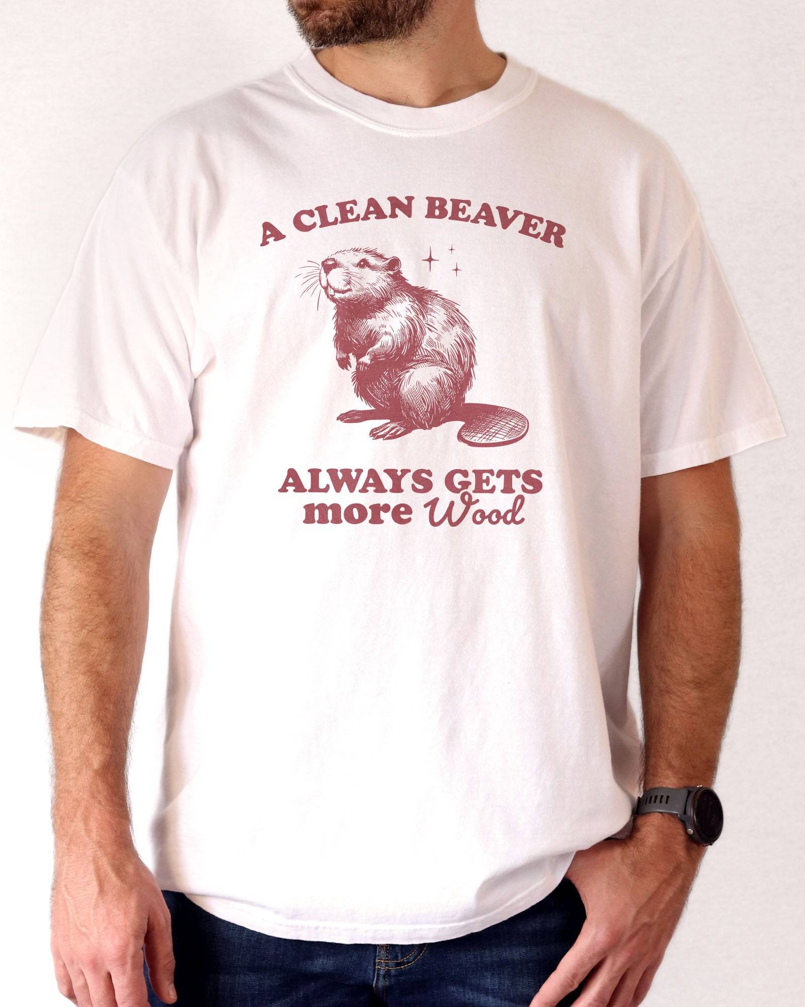 Man wearing white "A Clean Beaver Always Gets More Wood" shirt with funny retro beaver graphic.